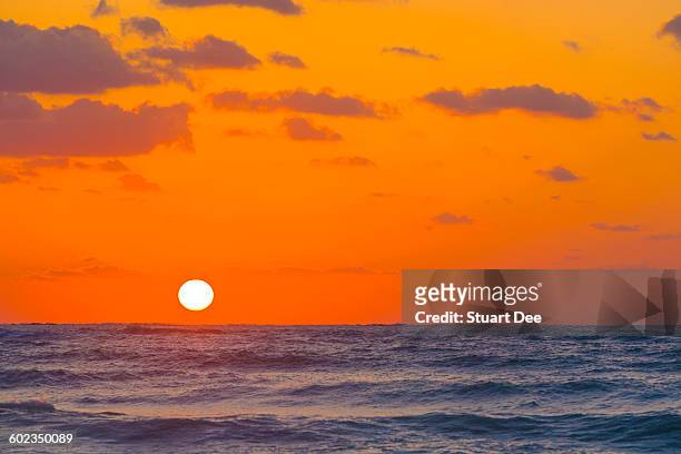 sunset over ocean - cayo santa maria stock pictures, royalty-free photos & images