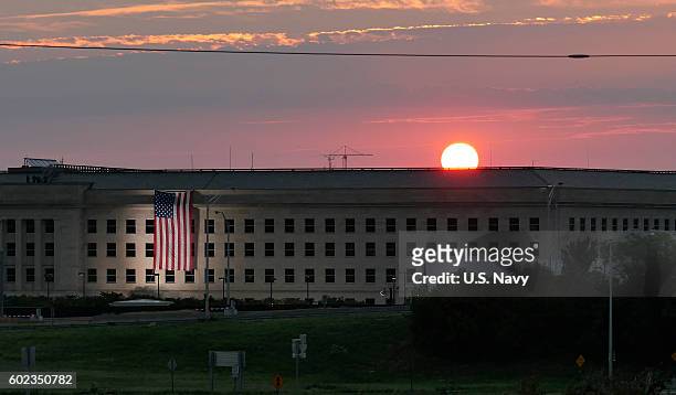 In this U.S. Navy handout, sunrise at the Pentagon prior to a ceremony to commemorate the 15th anniversary of the Sept. 11, 2001 terror attacks. The...