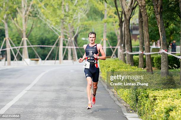 Alistair Brownlee of Great Britain competes in the running stage of the 2016 Beijing International Triathlon at Beijing Garden Expo on September 11,...