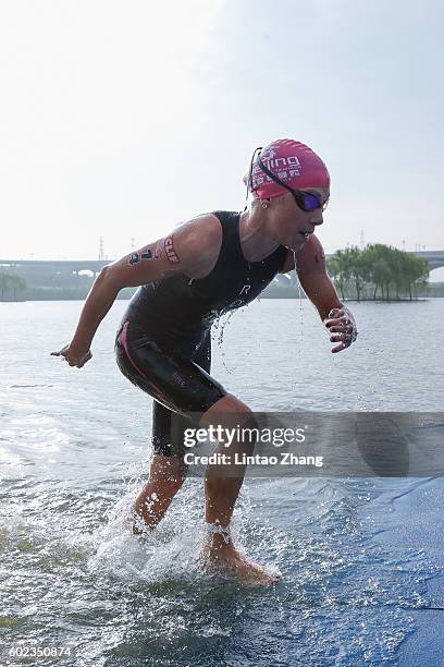 Holly Lawrence of Great Britain finishes the swimming stage during the 2016 Beijing International Triathlon at Beijing Garden Expo on September 11,...