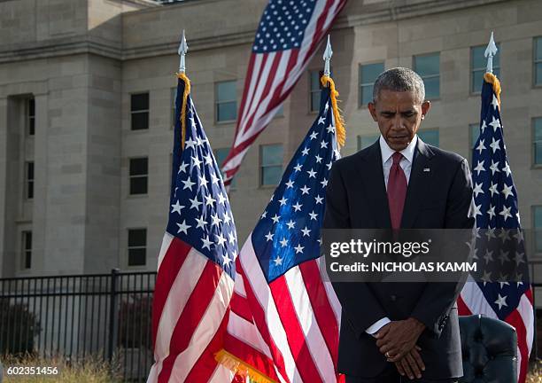 President Barack Obama attends a ceremony commemorating the September 11 attacks at the Pentagon in Washington, DC, on September 11, 2016. / AFP /...