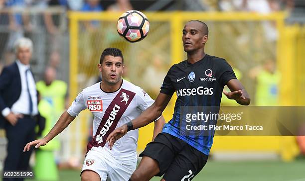 Iago Falque of FC Torino competes for the ball with Abdoulay Konko of Atalanta BC during the Serie a match between Atalanta BC and FC Torino at...