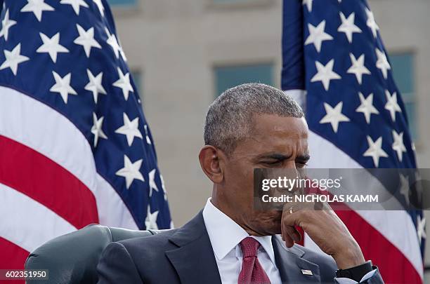 President Barack Obama attends a ceremony commemorating the September 11, 2001 attacks at the Pentagon in Washington, DC, on September 11, 2016. /...
