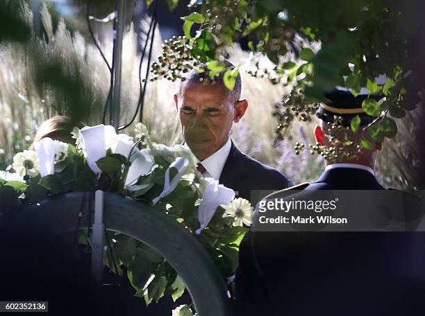 President Barack Obama lays a wreath during a ceremony to mark the 15th anniversary of the 9/11 terrorists attacks at the Pentagon Memorial September...