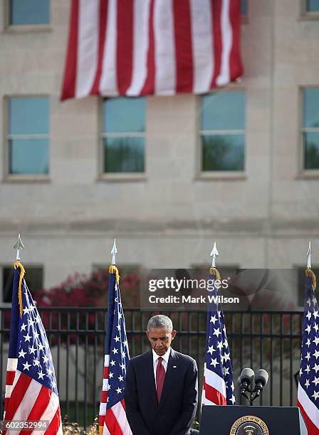 President Barack Obama participates in a moment of silence during a ceremony to mark the 15th anniversary of the 9/11 terrorists attacks at the...