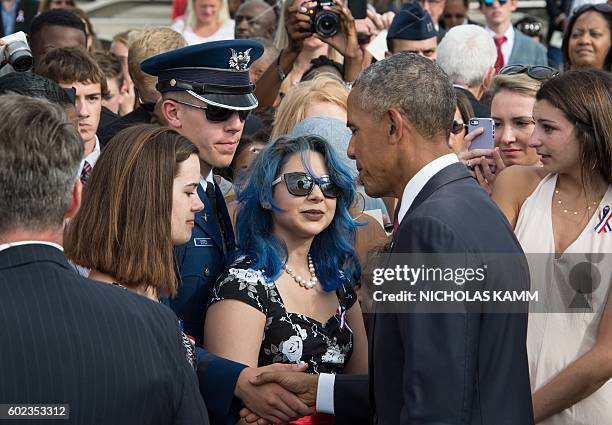 President Barack Obama greets attendees during a ceremony commemorating the September 11, 2001 attacks at the Pentagon in Washington, DC, on...