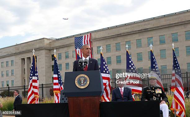 President Barack Obama participates in a moment of silence during a ceremony to mark the 15th anniversary of the 9/11 terrorists attacks at the...