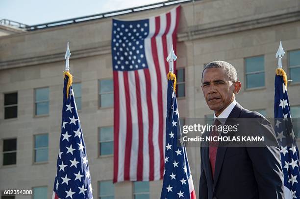 President Barack Obama attends a ceremony commemorating the September 11, 2001 attacks at the Pentagon in Washington, DC, on September 11, 2016. /...