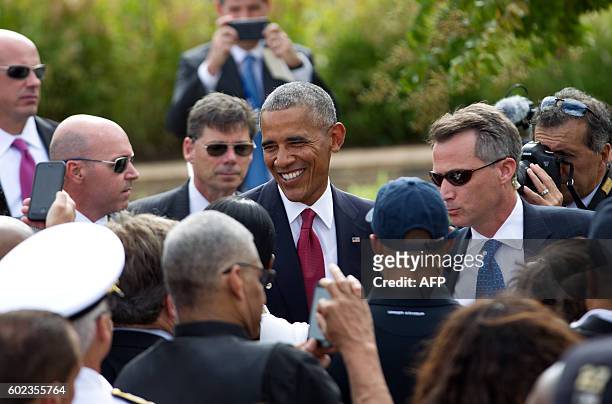 President Barack Obama greets attendees during a ceremony commemorating the September 11, 2001 attacks at the Pentagon in Washington, DC, on...