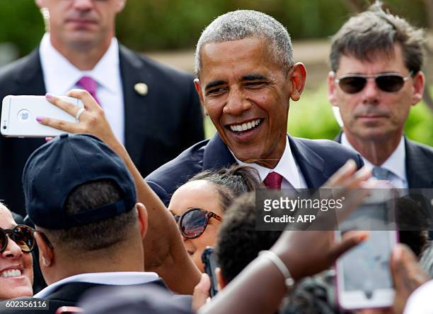President Barack Obama greets attendees during a ceremony commemorating the September 11, 2001 attacks at the Pentagon in Washington, DC, on...