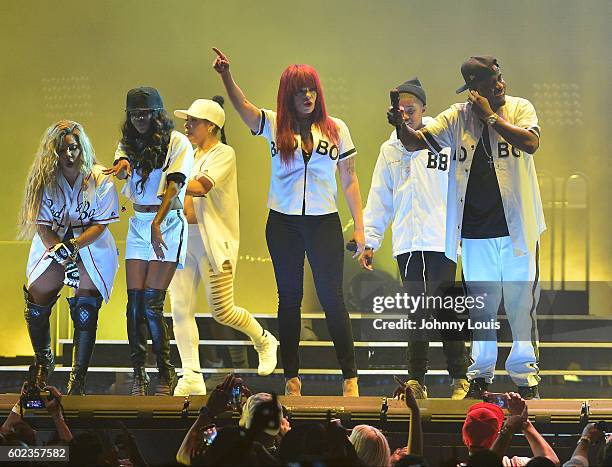 Keisha Spivey Epps and Pamela Long of Total, Faith Evans and Sean 'Diddy' Combs aka Puff Daddy preform onstage during the Bad Boy Family Reunion Tour...