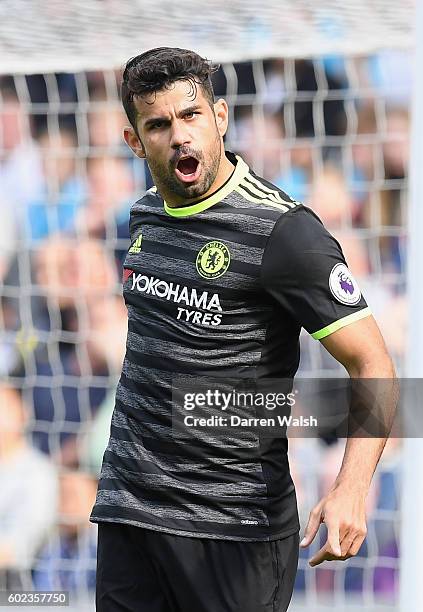Diego Costa of Chelsea celebrates as he scores their first goal during the Premier League match between Swansea City and Chelsea at Liberty Stadium...