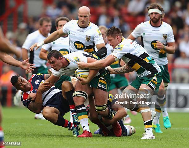 Louis Picamoles of Northampton is held by Tusi Pisi during the Aviva Premiership match between Bristol and Northampton Saints at Ashton Gate on...