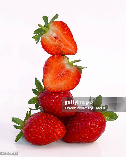 tower of fresh, ripe strawberries, on white - juicy strawberry stock pictures, royalty-free photos & images