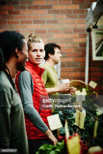 farmers working at produce stand in farmers market - dedication brick stock pictures, royalty-free photos & images