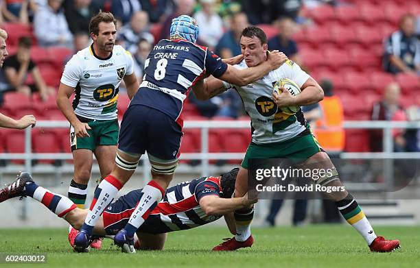 Louis Picamoles of Northampton is held by Jordan Crane during the Aviva Premiership match between Bristol and Northampton Saints at Ashton Gate on...