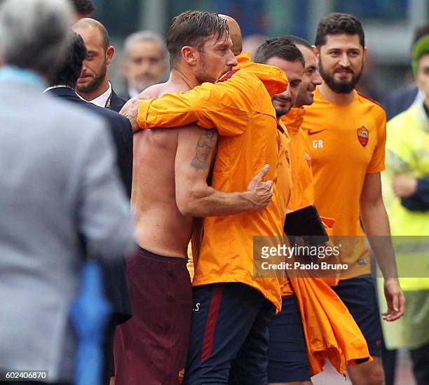 Francesco Totti of AS Roma after scoring the team's third goal from penalty spot embraces his head coach Luciano Spalletti during the Serie A match...