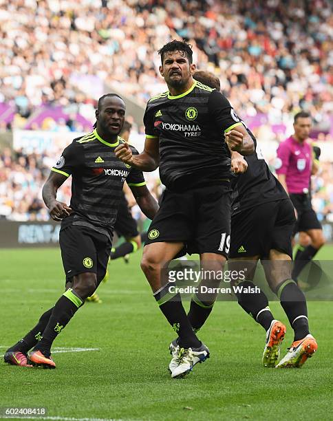 Diego Costa of Chelsea celebrates with team mates Victor Moses and Branislav Ivanovic as he scores their second goal during the Premier League match...