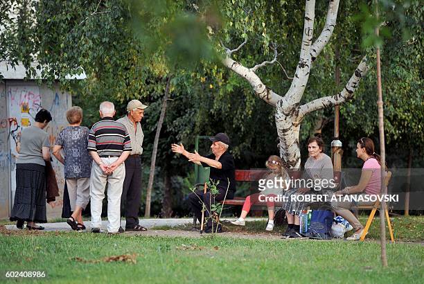 People gather in the streets and parks near Skpoje, on September 11 after a moderate 5.3-magnitude earthquake, preceded by two tremors, struck the...