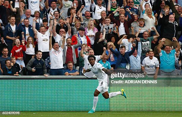 Swansea City's Dutch midfielder Leroy Fer celebrates after scoring their second goal during the English Premier League football match between Swansea...