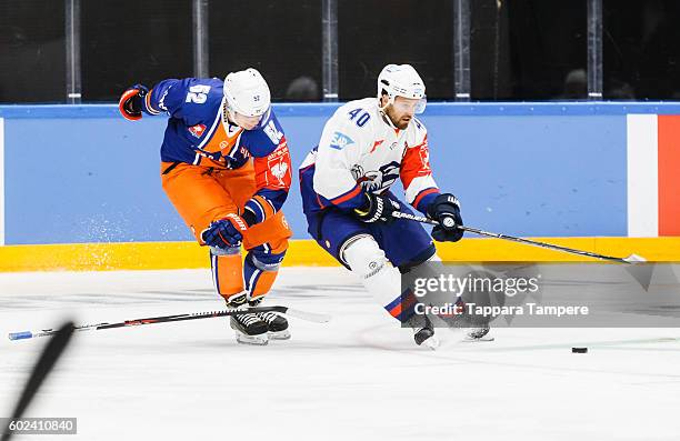 Daniel Sparre of Adler Mannheim receives a minor penalty after slashing stick off from Otso Rantakari of Tappara Tampere during the Champions Hockey...