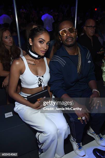 Regina Perera and Juicy J attend the Hood By Air fashion show during New York Fashion Week: The Shows at The Arc, Skylight at Moynihan Station on...