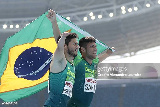 Yohansson Nascimento and Petrucio Ferreira dos Santos of Brazil celebrates after the Petrucio's victory in the Men's100 meter - T47 final at Olympic...