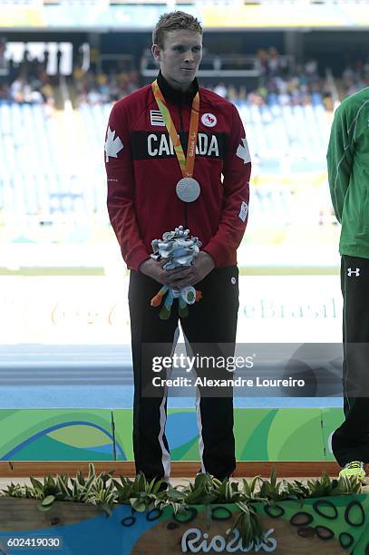 Silver Medalist Liam Stanley of Canada, Gold medalist Michael McKillop of Irlend and Bronze medalist Madjid Djemai of Algeria celebrate on the podium...