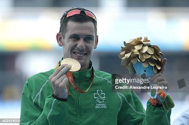 Silver Medalist Liam Stanley of Canada, Gold medalist Michael McKillop of Irlend and Bronze medalist Madjid Djemai of Algeria celebrate on the podium...