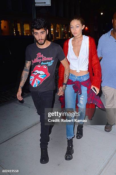 Gigi Hadid and boyfriend Zayn Malik hold hands as they walk in Manhattan on September 10, 2016 in New York City.