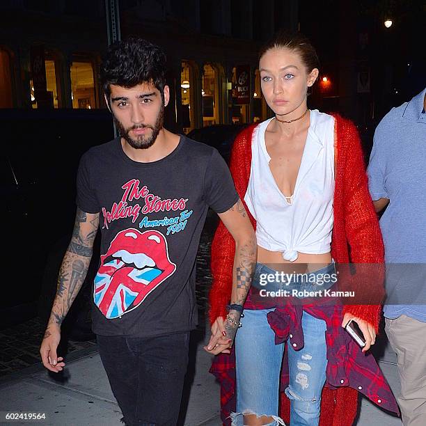 Gigi Hadid and boyfriend Zayn Malik hold hands as they walk in Manhattan on September 10, 2016 in New York City.