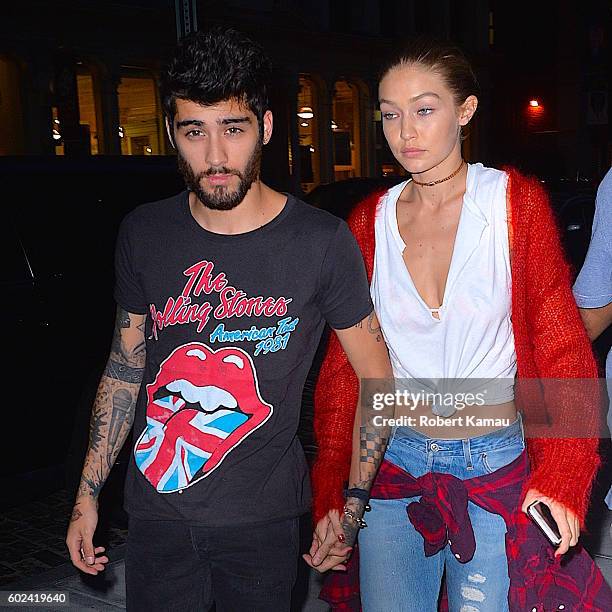 Gigi Hadid and boyfriend Zayn Malik hold hands as they walk in Manhattan on September 10, 2016 in New York City.