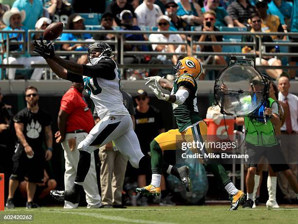 Julius Thomas of the Jacksonville Jaguars makes a touchdown catch during the game against the Green Bay Packers at EverBank Field on September 11,...