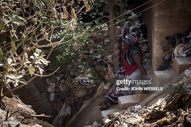 Sangoma, or traditional doctor performs a prayer in front of the disused Langlaagte gold mine shaft entrance, where an unknown amount of "Zama Zamas"...