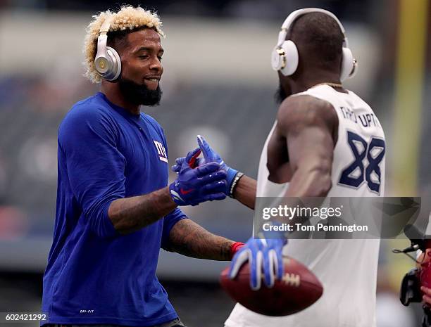 Odell Beckham of the New York Giants greets Dez Bryant of the Dallas Cowboys during pregame warm up at AT&T Stadium on September 11, 2016 in...