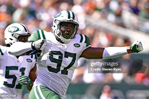 Lawrence Thomas of the New York Jets celebrates after making a tackle on a punt return by the Cincinnati Bengals during the second quarter at MetLife...