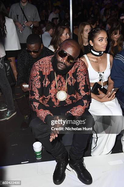 Rick Ross and Regina Perera attend the Hood By Air fashion show during New York Fashion Week: The Shows at The Arc, Skylight at Moynihan Station on...