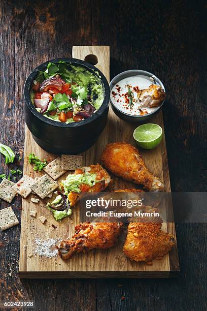 fried chicken with guacamole - bbq avocado foto e immagini stock