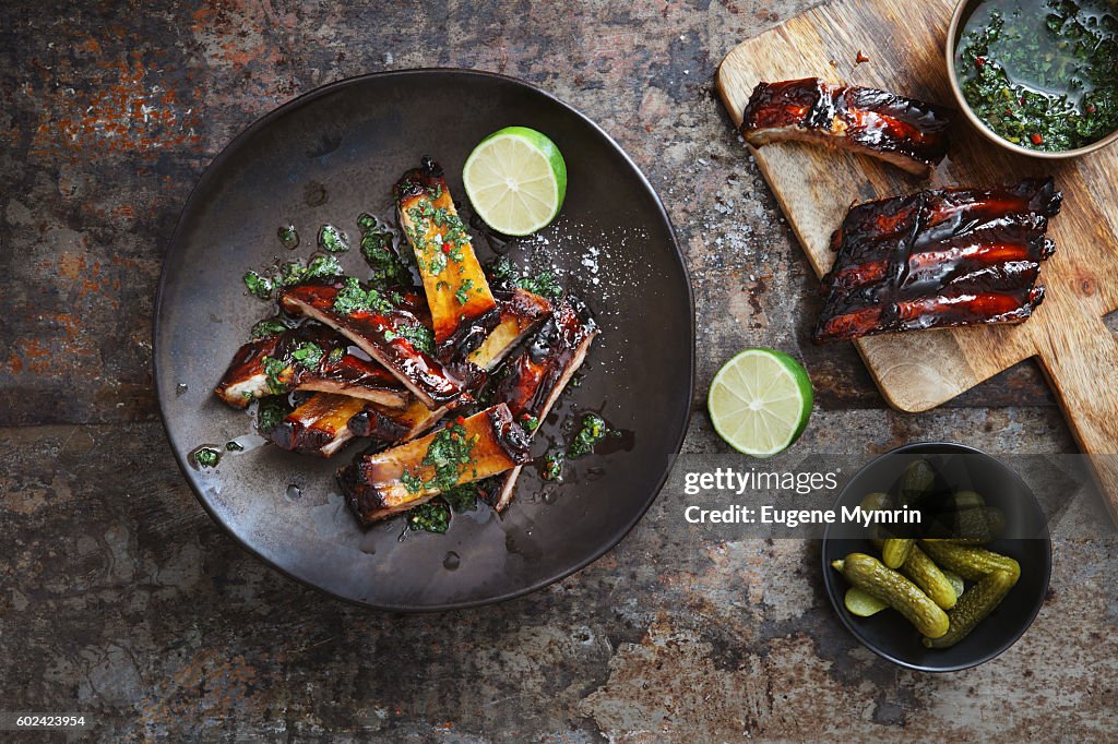 Pomegranate and red wine glazed pork ribs with chimichurri sauce