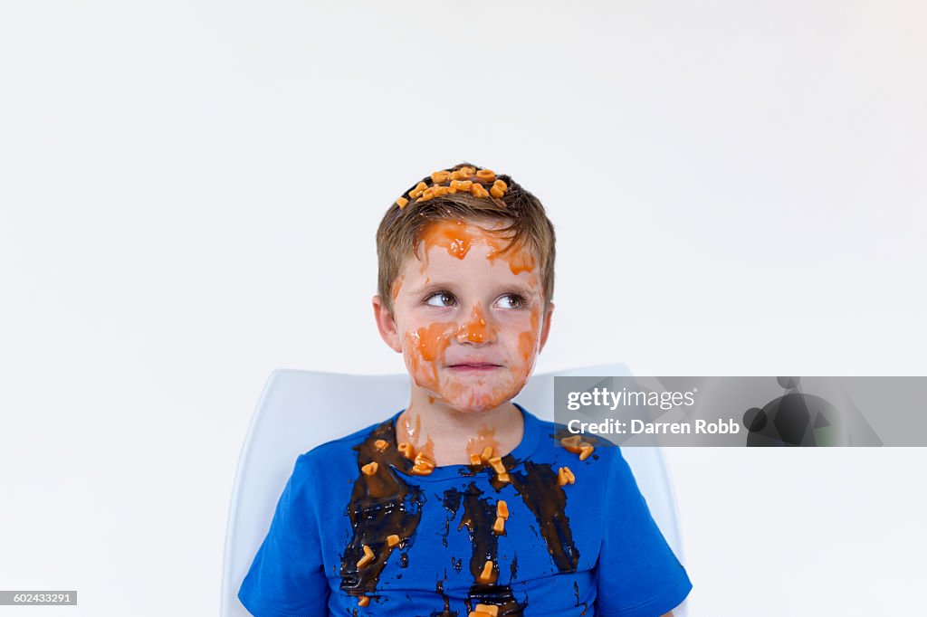 Boy covered in alphabet spaghetti