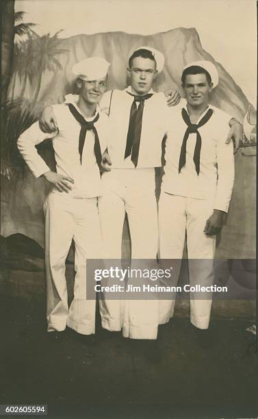Three sailors posing for arcade photo depicting Diamondhead.