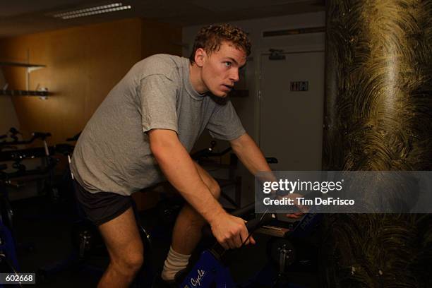 Defenseman Martin Skoula of the Colorado Avalanche works out on the stationary bike during a training camp session during the 2001 NHL Challenge...