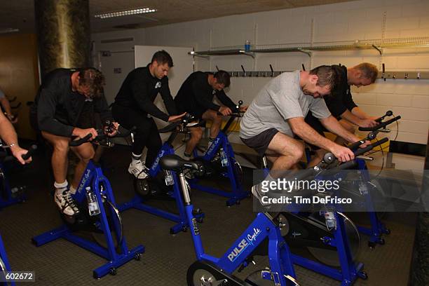 Rob Blake, left, assistant coach Eric Lacroix, Darryl Shannon, Rick Berry, Greg de Vries of the Colorado Avalanche spend time on the stationary bikes...