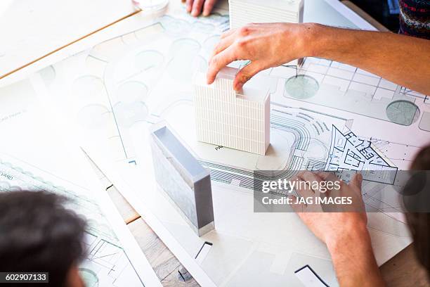 architects looking at architects drawings - architectural model stock pictures, royalty-free photos & images