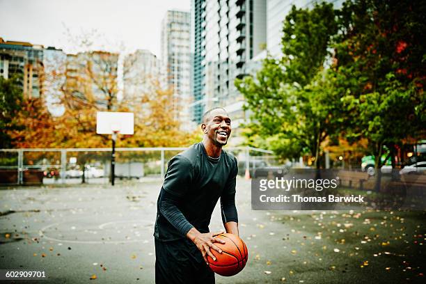 Laughing basketball player preparing to shoot