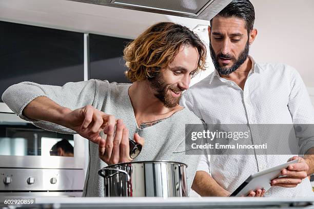 Two Men Cookware 21 Emma Stove All Stock Photos, High-Res Pictures, and Images - Getty ...