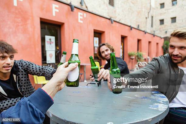 friends making a toast sitting outdoor - italy beer stock pictures, royalty-free photos & images