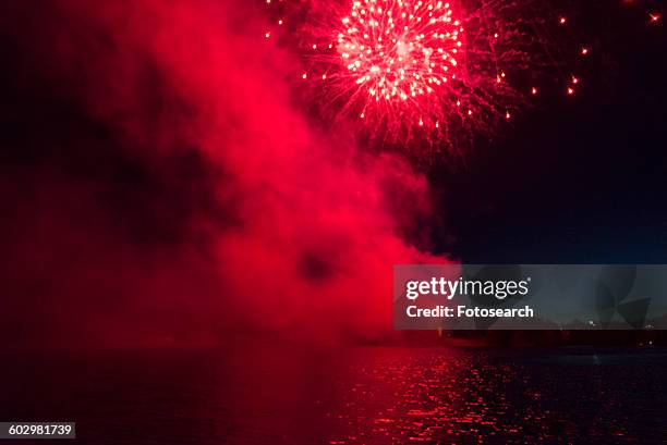 fireworks display at night on canada day - kenora stockfoto's en -beelden