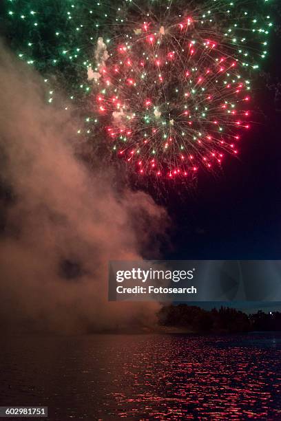 fireworks display at night on canada day - kenora stockfoto's en -beelden