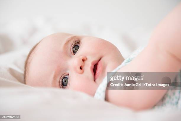 portrait of baby girl (12-17 months) - groene ogen stockfoto's en -beelden